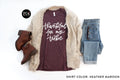 Thankful for My Tribe graphic tee in Heather Maroon, styled flat lay