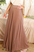 Mocha pleated palazzo pants showing the high waistband and flowing wide legs