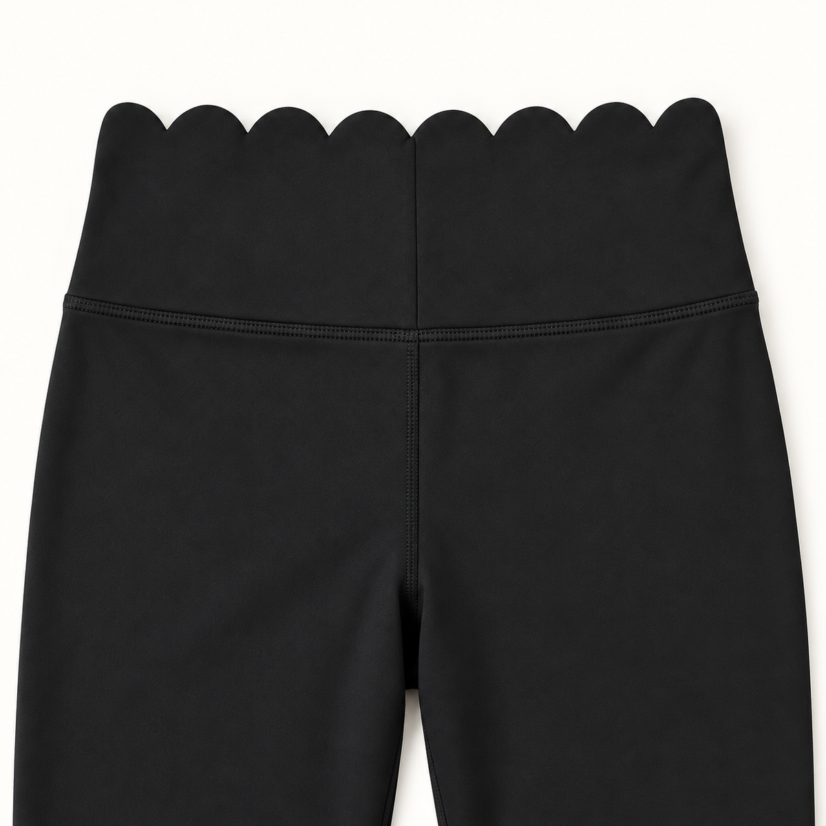 Close-up of black scalloped waistband detail
