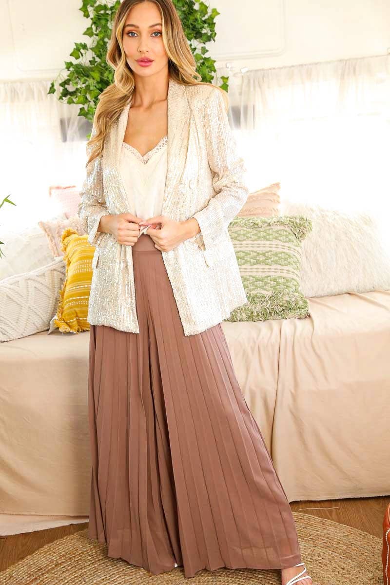 Mocha wide-leg pants styled with a white top and light jacket