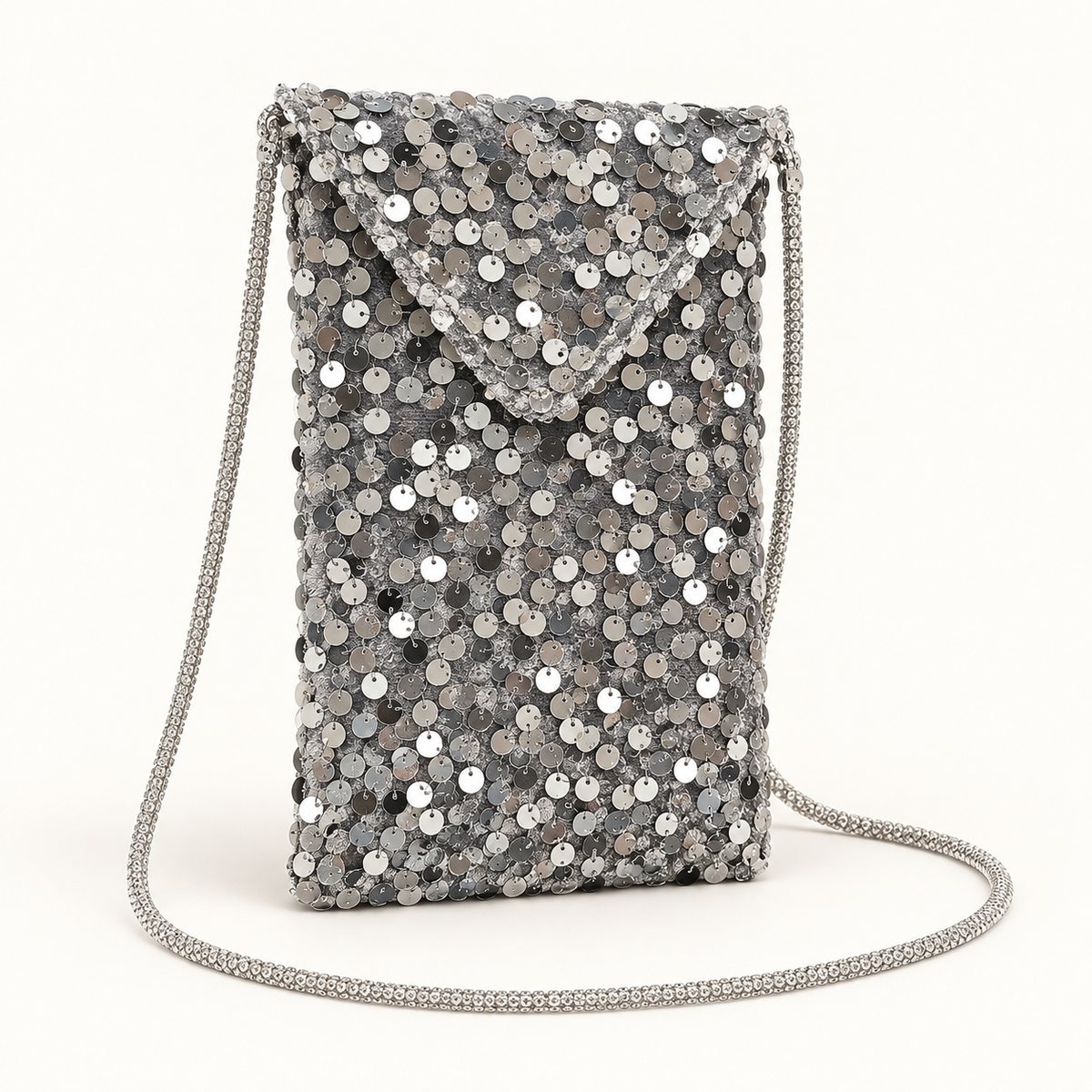 Close view of silver sequin envelope crossbody bag