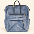 Ellie backpack in distressed blue with gold-tone zipper details