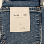 Flying Monkey Black Label F5391 medium-wash denim brand tag detail